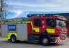 Firefighters battle blaze in bin lorry on main road firefighters-battle-blaze-in-bin-lorry-on-main-road