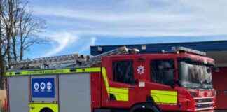 Firefighters battle blaze in bin lorry on main road firefighters-battle-blaze-in-bin-lorry-on-main-road